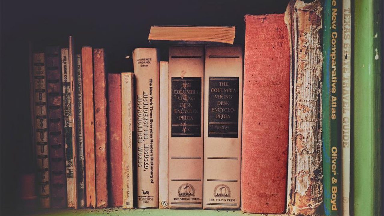 A shelf of vintage encyclopedias, evoking why you should not edit your own Wikipedia page